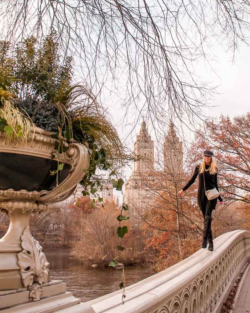 walking through life on bow bridge in Central Park in New York city